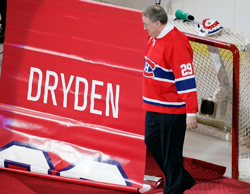 Former Montreal Canadiens goaltender Ken Dryden looks at the banner as his number "29" is retired in Montreal January 29, 2007.