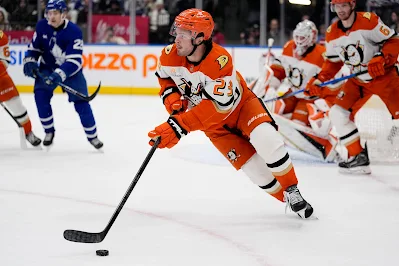 Mason McTavish, Anaheim Ducks center, skates with puck