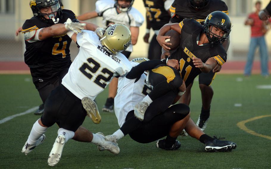 Hajime Reed fights for yards.