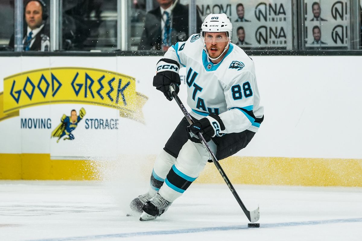 Utah Mammoth defenseman Nate Schmidt (88) scans the ice while maintaining possession of the puck during first period of NHL preseason game against Vegas Golden Knights on Thursday, Sept. 25, 2025 in Las Vegas.