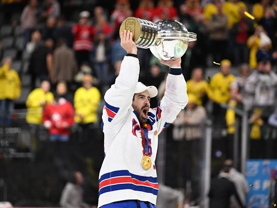  Team U.S.A.’s Conor Garland raises the world title trophy on May 25. He had 10 points (5-5) in the tournament.