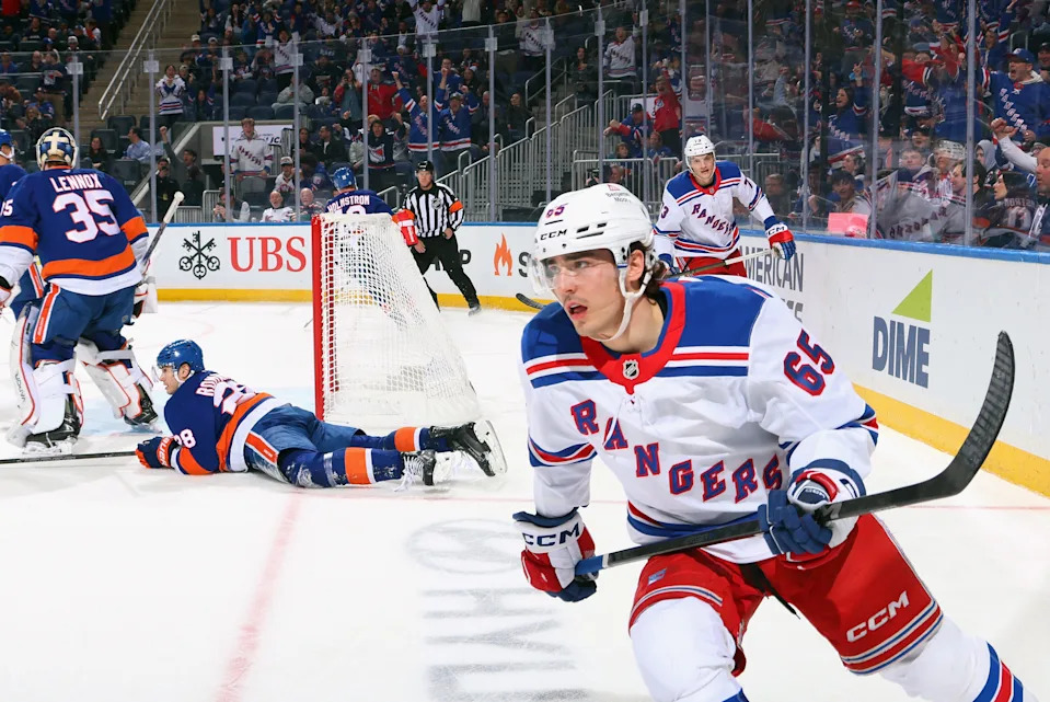 ELMONT, NEW YORK - APRIL 10: Brett Berard #65 of the New York Rangers scores at 12:37 of the third period against Tristan Lennox #35 of the New York Islanders at UBS Arena on April 10, 2025 in Elmont, New York. (Photo by Bruce Bennett/Getty Images)