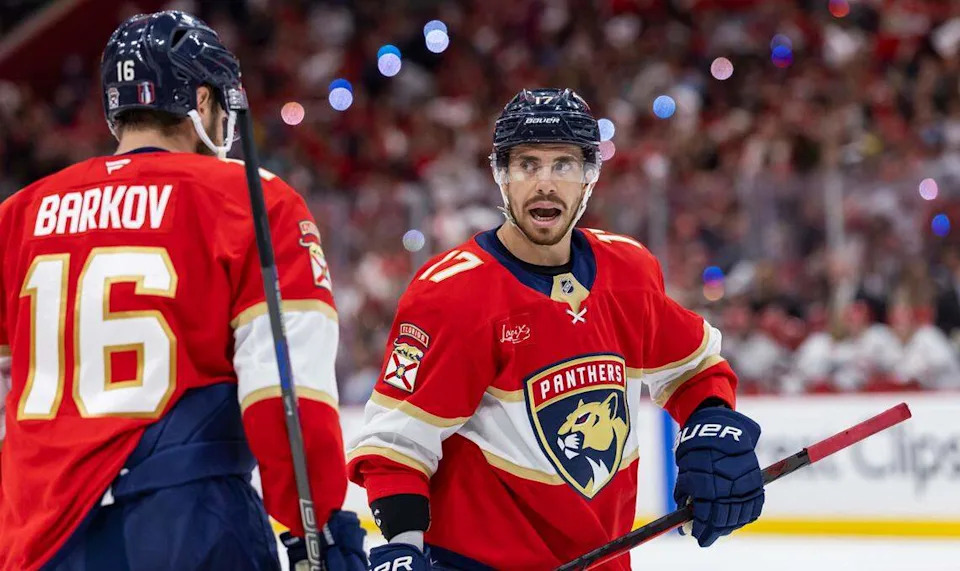 Florida Panthers centers Evan Rodrigues (17) and Aleksander Barkov (16) talk during a timeout against Carolina Hurricanes in the second period of Game 4 during the Eastern Conference final of the NHL Stanley Cup playoffs at Amerant Bank Arena on Monday, May 26, 2025, in Sunrise, Fla.