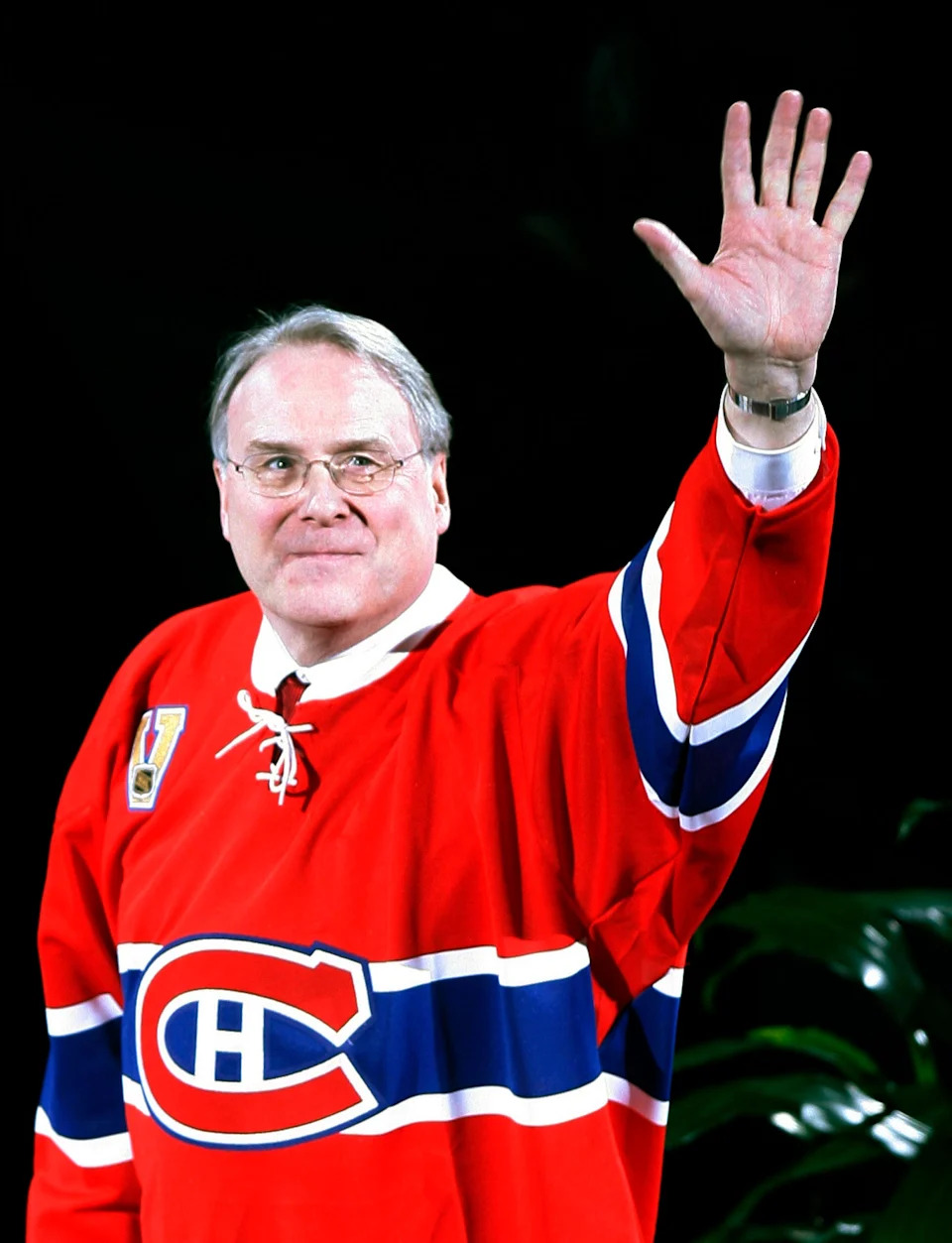 Former Montreal Canadiens goaltender Ken Dryden waves to the crowd during a ceremony to retire his number "29."
