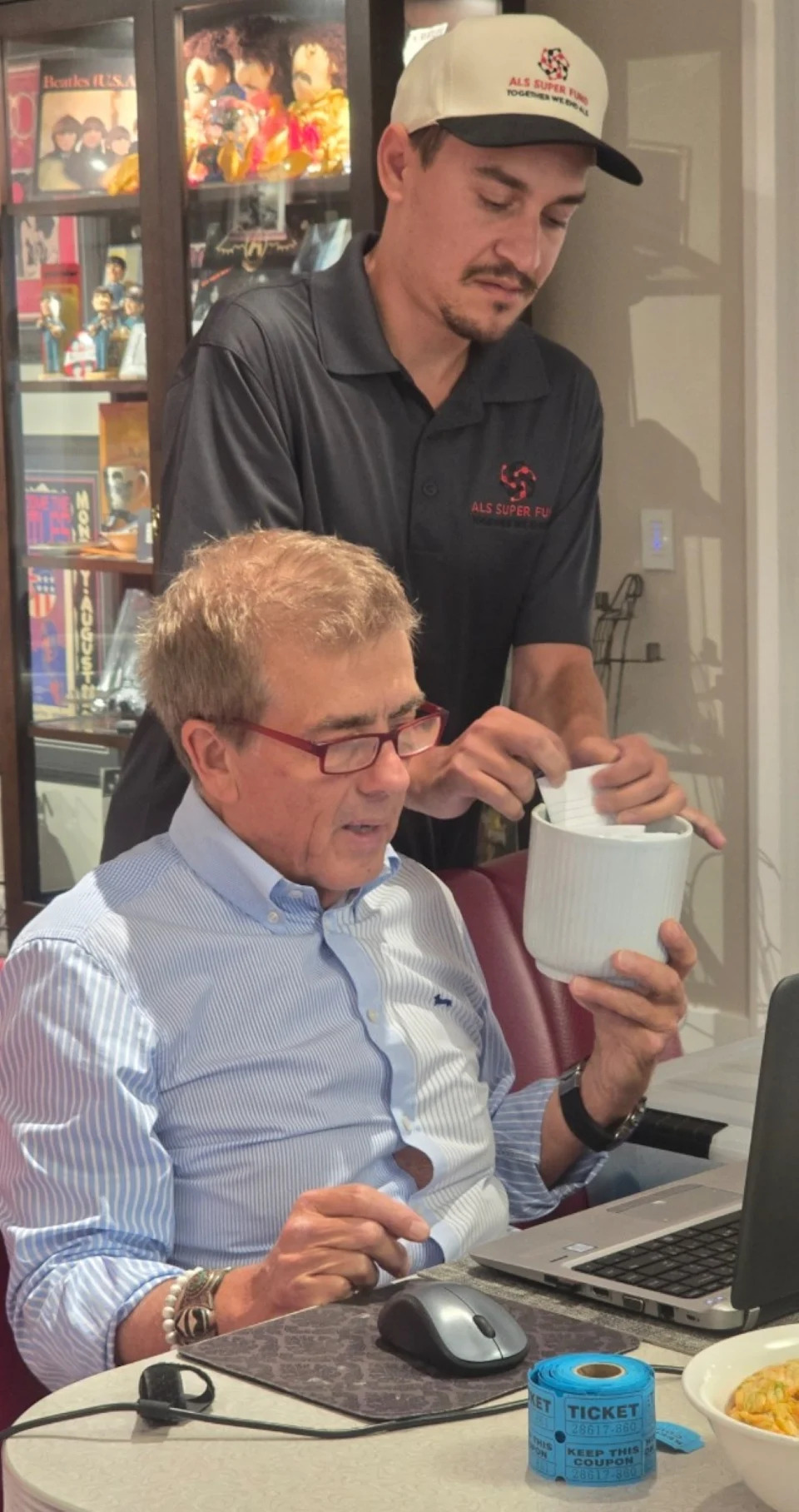  Louis Del Re, an ALS patient and fundraiser from the GTA, and his father Gino help host and Leafs memorabilia collector Mike Wilson with Monday night’s draw for NHL game night packages for the late Mark Kirton’s ALS Super Fund.