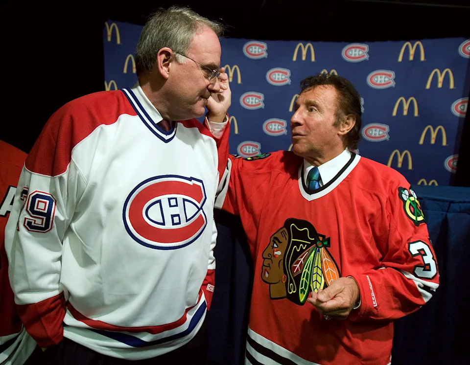 Hockey greats Ken Dryden (L) and Tony Esposito (R) meet before a game between the Chicago Blackhawks and the Montreal Canadiens.