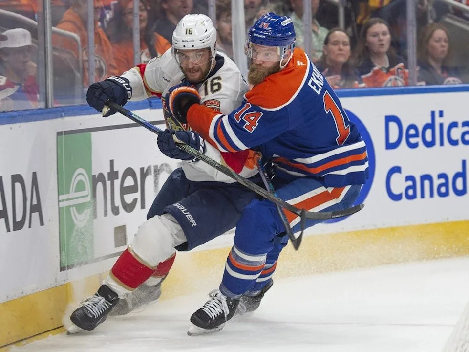 Mattias Ekholm (14) of the Edmonton Oilers checks Aleksander Barkov (16) of the Florida Panthers in game six of the Stanley Cup final in Edmonton on June 14, 2025.