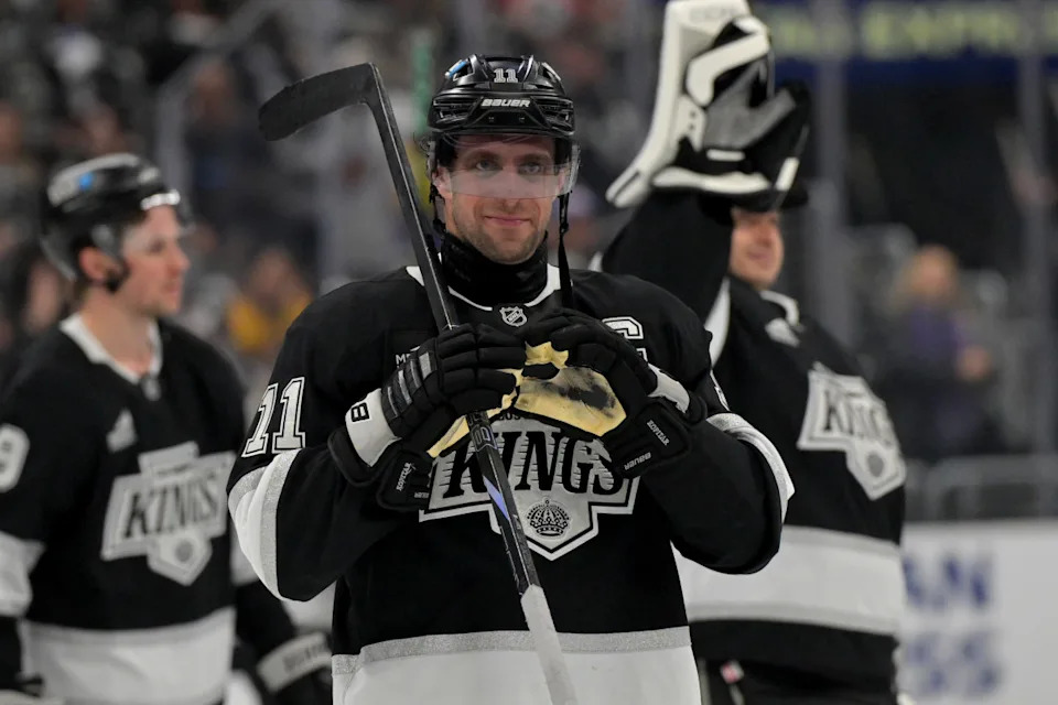 Los Angeles Kings center Anze Kopitar (11) makes a heart with his gloves.Jayne Kamin-Oncea-Imagn Images