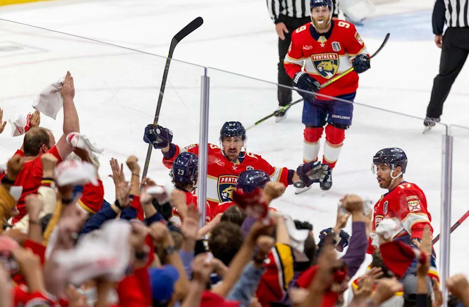 Florida Panthers center Carter Verhaeghe (23) celebrates with teammates Brad Marchand (63), Evan Rodrigues (17), and defenseman Nate Schmidt (88) after scoring a goal against the Edmonton Oilers during the first period of Game 3 in the Stanley Cup Final at Amerant Bank Arena on Monday, June 9, 2025, in Sunrise, Fla.