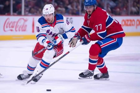Oct 22, 2024; Ottawa, Ontario, CAN; New York Rangers left wing Artemi Panarin (10) battles with Montreal Canadiens center Kirby Dach (77) in the first period at the Bell Centre. Mandatory Credit: Marc DesRosiers-Imagn Images