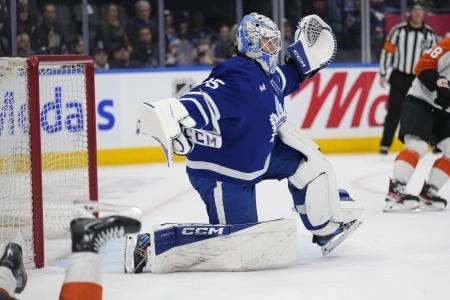 Jan 5, 2025; Toronto, Ontario, CAN; Toronto Maple Leafs goaltender Dennis Hildeby (35) reacts after a collision with a Philadelphia Flyers player during the second period at Scotiabank Arena. Mandatory Credit: John E. Sokolowski-Imagn Images