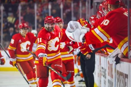 Apr 3, 2025; Calgary, Alberta, CAN; Calgary Flames center Nazem Kadri (91) celebrates his goal with teammates against the Anaheim Ducks during the first period at Scotiabank Saddledome. Mandatory Credit: Sergei Belski-Imagn Images