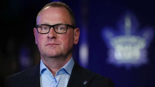 Toronto Maple Leafs general manager Brad Treliving pictured in front of the team logo during a media availability. Toronto Maple Leafs general manager Brad Treliving pictured in front of the team logo during a media availability.