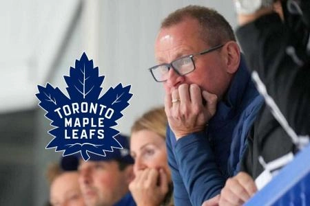 Toronto Maple Leafs general manager Brad Treliving looks on, watching play from the stands