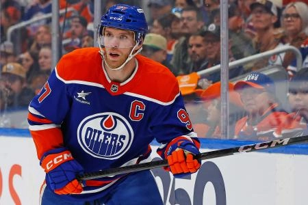 Nov 12, 2024; Edmonton, Alberta, CAN; Edmonton Oilers forward Connor McDavid (97) looks for a loose puck against the New York Islanders at Rogers Place