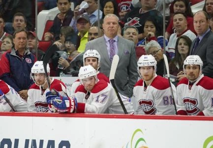 Apr 7, 2016; Raleigh, NC, USA; Montreal Canadiens head coach Michel Therrien (C) looks on from the bench during the third period against the Carolina Hurricanes at PNC Arena. The Canadiens won 4-2. Mandatory Credit: James Guillory-Imagn Images