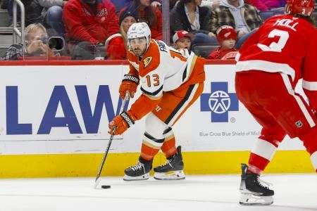 Feb 23, 2025; Detroit, Michigan, USA; Anaheim Ducks center Robby Fabbri (13) handles the puck during the first period of the game between the Detroit Red Wings and the Anaheim Ducks at Little Caesars Arena. Mandatory Credit: Brian Bradshaw Sevald-Imagn Images