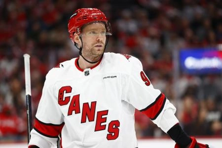 Mar 22, 2024; Washington, District of Columbia, USA; Carolina Hurricanes center Evgeny Kuznetsov (92) looks on from the ice during a stoppage in play in the second period against the Washington Capitals at Capital One Arena. Mandatory Credit: Amber Searls-Imagn Images
