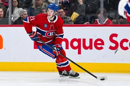 Jan 21, 2025; Montreal, Quebec, CAN; Montreal Canadiens defenseman Kaiden Guhle (21) plays the puck against the Tampa Bay Lightning during the second period at Bell Centre. Mandatory Credit: David Kirouac-Imagn Images Jan 21, 2025; Montreal, Quebec, CAN; Montreal Canadiens defenseman Kaiden Guhle (21) plays the puck against the Tampa Bay Lightning during the second period at Bell Centre. Mandatory Credit: David Kirouac-Imagn Images