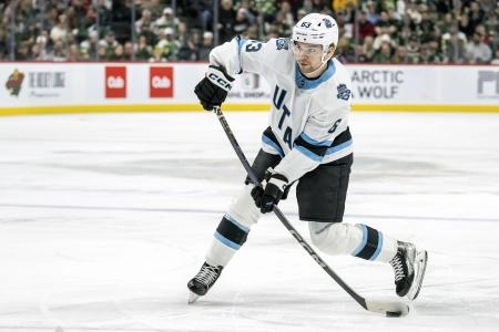Dec 20, 2024; Saint Paul, Minnesota, USA; Utah Hockey Club forward Matias Maccelli (63) takes a shot on goal against the Minnesota Wild during the third period at Xcel Energy Center. Mandatory Credit: Nick Wosika-Imagn Images