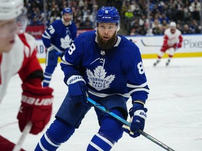Toronto Maple Leafs defenseman Jake Muzzin pursues a Detroit Red Wings player
