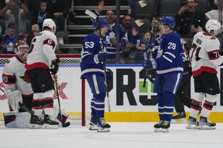 Toronto Maple Leafs forward Easton Cowan celebrates his goal against the Ottawa Senators Toronto Maple Leafs forward Easton Cowan celebrates his goal against the Ottawa Senators
