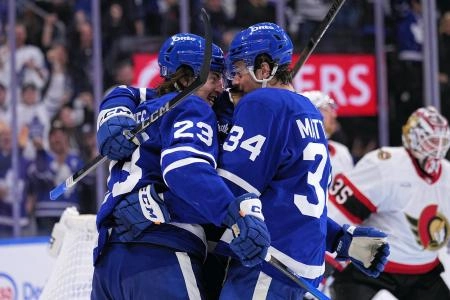 Apr 20, 2025; Toronto, Ontario, CAN; Toronto Maple Leafs forward Auston Matthews (34) congratulates forward Matthew Knies (23) on his goal against the Ottawa Senators during the third period of game one of the first round of the 2025 Stanley Cup Playoffs at Scotiabank Arena