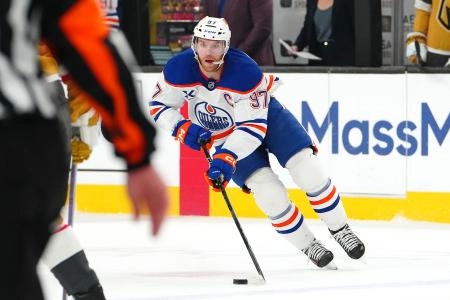May 14, 2025; Las Vegas, Nevada, USA; Edmonton Oilers center Connor McDavid (97) skates against the Vegas Golden Knights during the first period of game five of the second round of the 2025 Stanley Cup Playoffs at T-Mobile Arena. Mandatory Credit: Stephen R. Sylvanie-Imagn Images