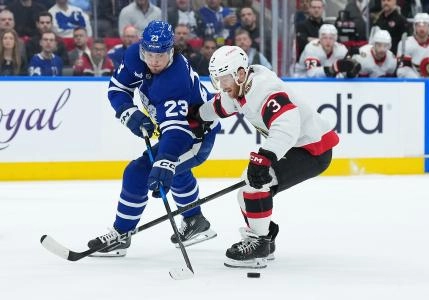 Apr 29, 2025; Toronto, Ontario, CAN; Toronto Maple Leafs left wing Matthew Knies (23) battles for the puck with Ottawa Senators defenseman Nick Jensen (3) in the first period during game five of the first round of the 2025 Stanley Cup Playoffs at Scotiabank Arena. Mandatory Credit: Nick Turchiaro-Imagn Images Apr 29, 2025; Toronto, Ontario, CAN; Toronto Maple Leafs left wing Matthew Knies (23) battles for the puck with Ottawa Senators defenseman Nick Jensen (3) in the first period during game five of the first round of the 2025 Stanley Cup Playoffs at Scotiabank Arena. Mandatory Credit: Nick Turchiaro-Imagn Images