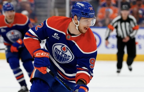 Edmonton's Vasily Podkolzin skates in game action
