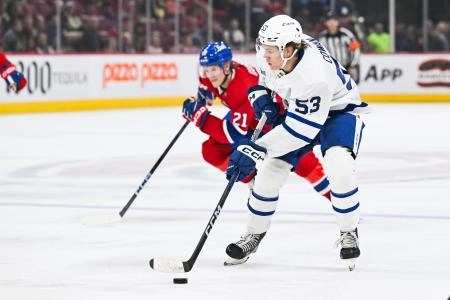 Sep 30, 2023; Montreal, Quebec, CAN; Toronto Maple Leafs right wing Easton Cowan (53) plays the puck against the Montreal Canadiens during the first period at Bell Centre