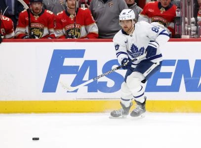 May 11, 2025; Sunrise, Florida, USA; Toronto Maple Leafs right wing William Nylander (88) passes the puck against the Florida Panthers during the third period in game four of the second round of the 2025 Stanley Cup Playoffs at Amerant Bank Arena. Mandatory Credit: Kim Klement Neitzel-Imagn Images