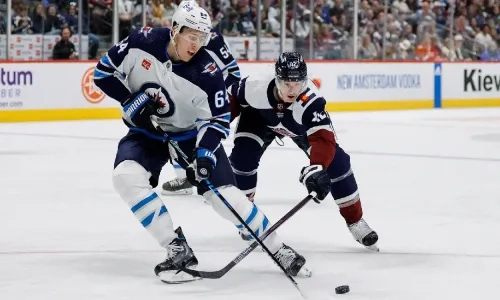 Winnipeg's Logan Stanley checked by Colorado defender Winnipeg's Logan Stanley checked by Colorado defender