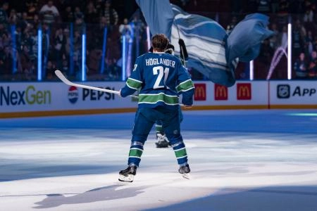 Canucks forward Nils Hoglander (21) skates out as the game's second star against the Winnipeg Jets at Rogers Arena. Canucks forward Nils Hoglander (21) skates out as the game's second star against the Winnipeg Jets at Rogers Arena.