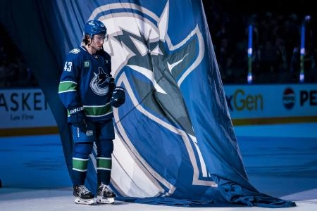 Vancouver Canucks defenseman Quinn Hughes (43) skates out as the third star of the game against the San Jose Sharks at Rogers Arena. Vancouver Canucks defenseman Quinn Hughes (43) skates out as the third star of the game against the San Jose Sharks at Rogers Arena.