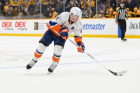 Apr 8, 2025; Nashville, Tennessee, USA; New York Islanders center Bo Horvat (14) skates with the puck during the over-time period against the Nashville Predators at Bridgestone Arena. Mandatory Credit: Steve Roberts-Imagn Images