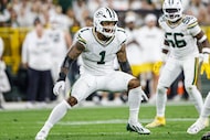 Green Bay Packers defensive end Micah Parsons (1) rushes during a NFL football game against...