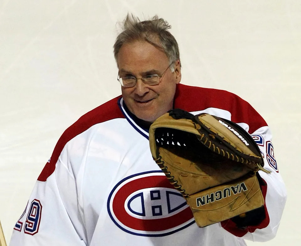 Former Montreal Canadiens goaltender Ken Dryden waves to the crowd during the Montreal Canadiens' 100th anniversary ceremony.