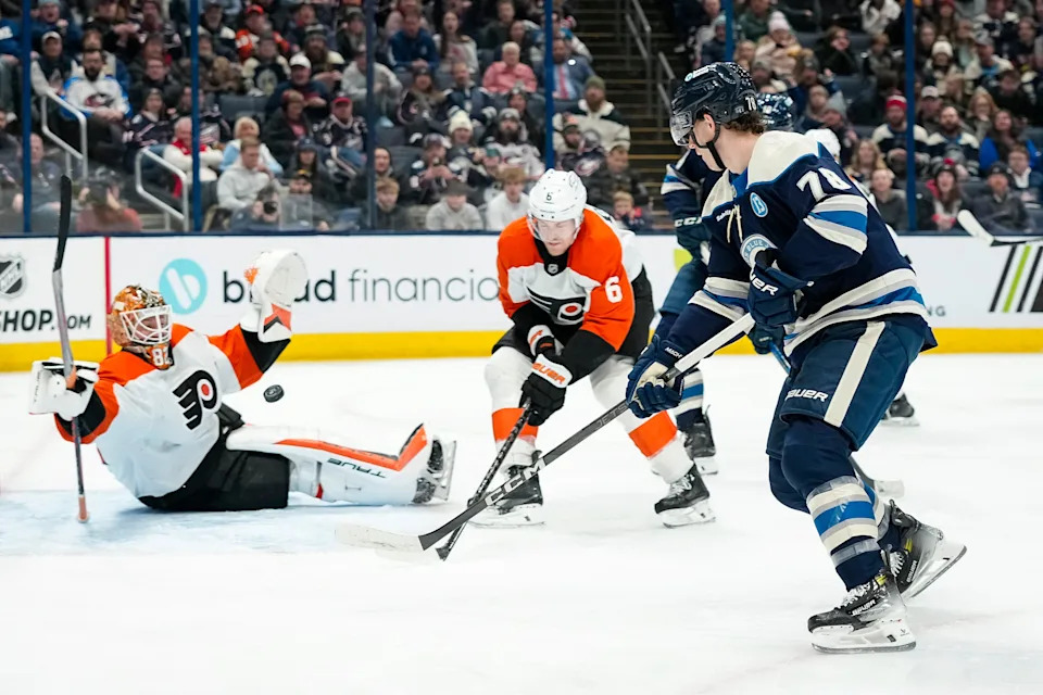 Philadelphia Flyers goaltender Ivan Fedotov (82) stops a shot from Columbus Blue Jackets defenseman Damon Severson (78) during the third period of the NHL hockey game at Nationwide Arena in Columbus on Jan. 14, 2025. The Blue Jackets won 3-2 in a shootout.