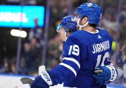 Toronto Maple Leafs forwards Calle Jarnkrok and Nic Robertson celebrating a goal. Toronto Maple Leafs forwards Calle Jarnkrok and Nic Robertson celebrating a goal.