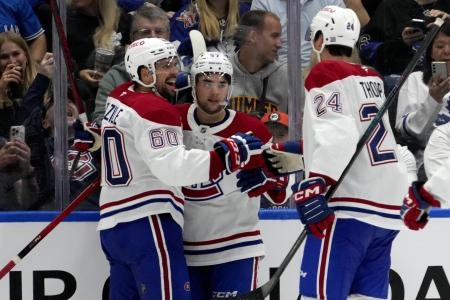 Sep 27, 2025; Toronto, Ontario, CAN; Montreal Canadiens forward Alex Belzile (60) and forward Tyler Thorpe (24) congratulate forward Sean Farrell (57) on his goal against the Toronto Maple Leafs during the third period at Scotiabank Arena. Mandatory Credit: John E. Sokolowski-Imagn Images