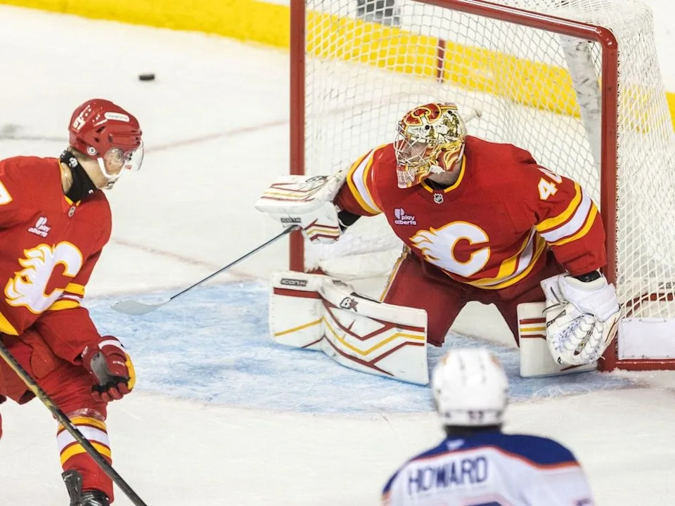  Calgary Flames goaltender Arsenii Sergeev deflects the puck during the prospects game against the Edmonton Oilers at the Scotiabank Saddledome on Sunday, September 14, 2025. Brent Calver/Postmedia