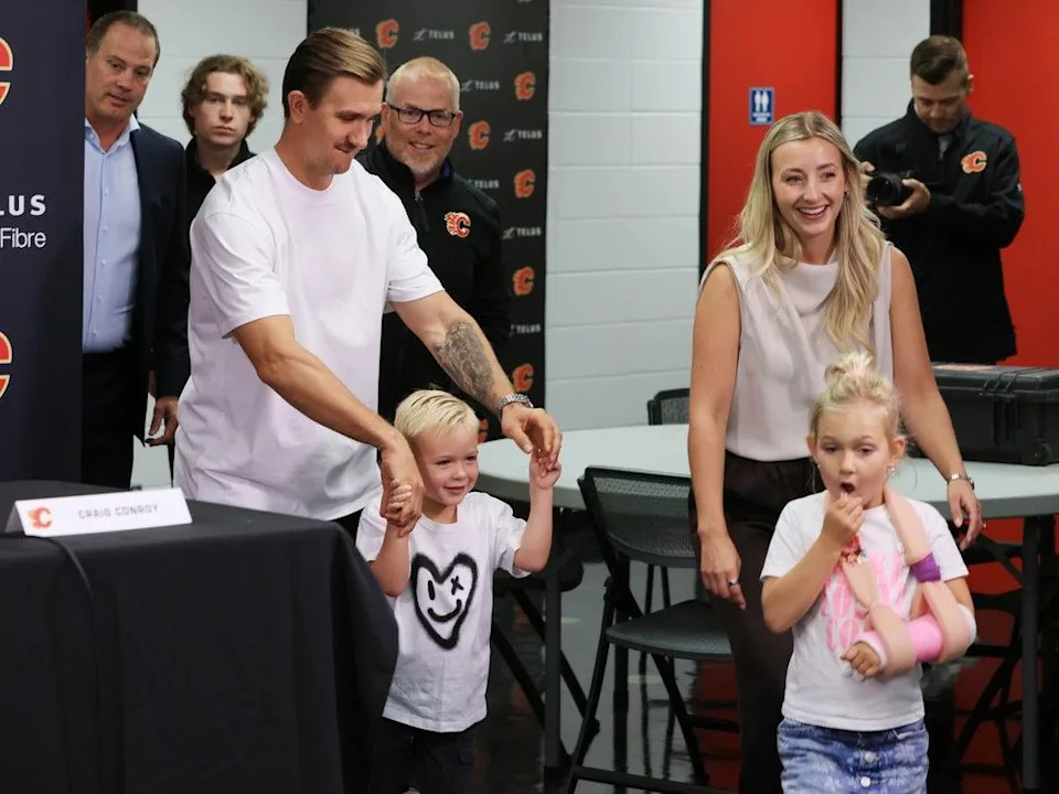  Mikael Backlund arrives for Wednesday’s press conference with his wife Frida and children Tillie and Oliver.