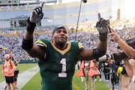 Green Bay Packers defensive end Micah Parsons (1) celebrates after an NFL football game...