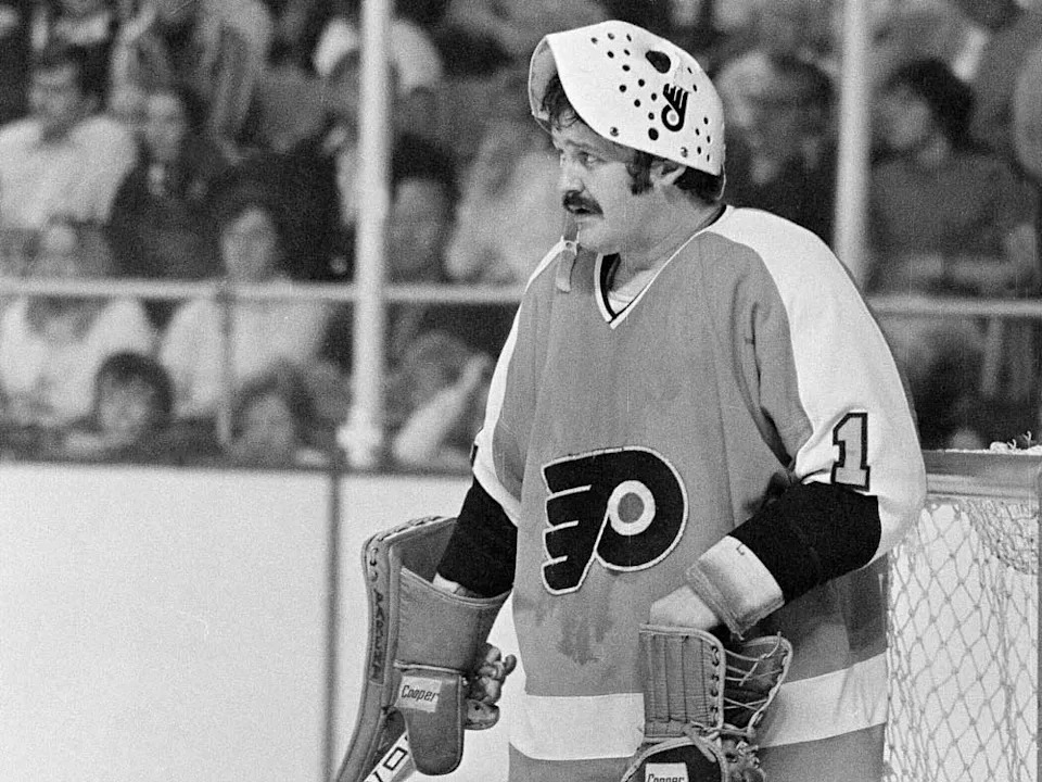  Philadelphia Flyers goalie Bernie Parent raises his mask to take a break during the Stanley Cup finals in Buffalo, N.Y., May 28, 1975, against the Buffalo Sabres.
