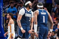 Dallas Mavericks forward Anthony Davis celebrates with guard Jaden Hardy (1) after dunking...