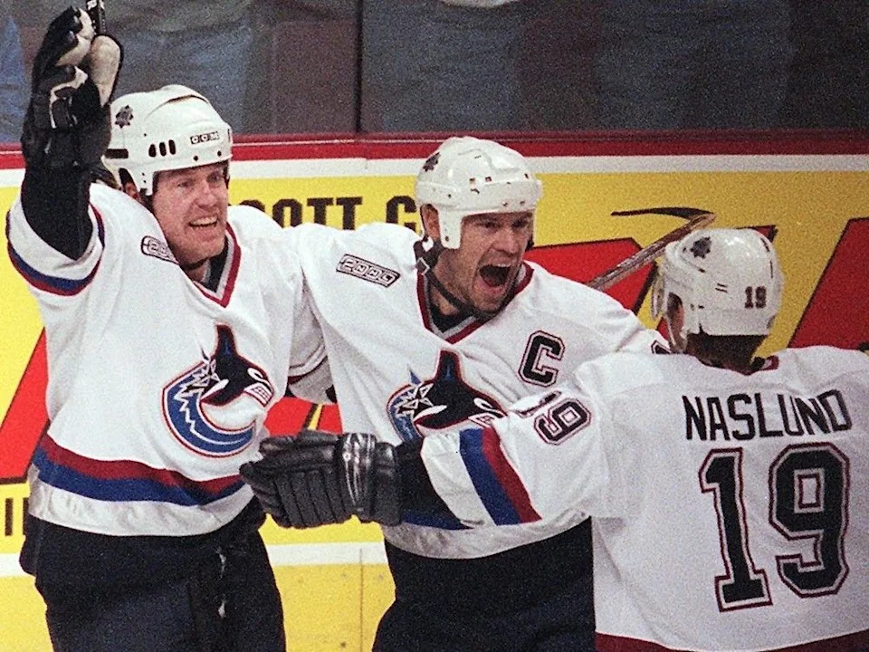  Vancouver Canucks captain Mark Messier celebrates his first period goal with Trent Klatt and Markus Naslund against the Edmonton Oilers at GM Place in Vancouver on Friday April 7, 2000.