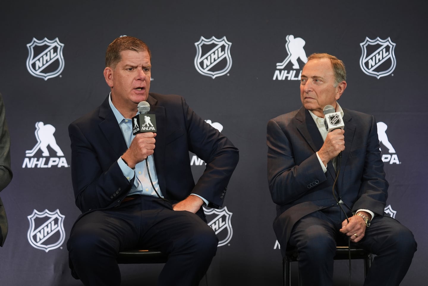 NHLPA executive director and former Boston mayor Marty Walsh (left) and NHL commissioner Gary Bettman agreed to a four-year collective bargaining agreement in July, parts of which will take effect immediately.