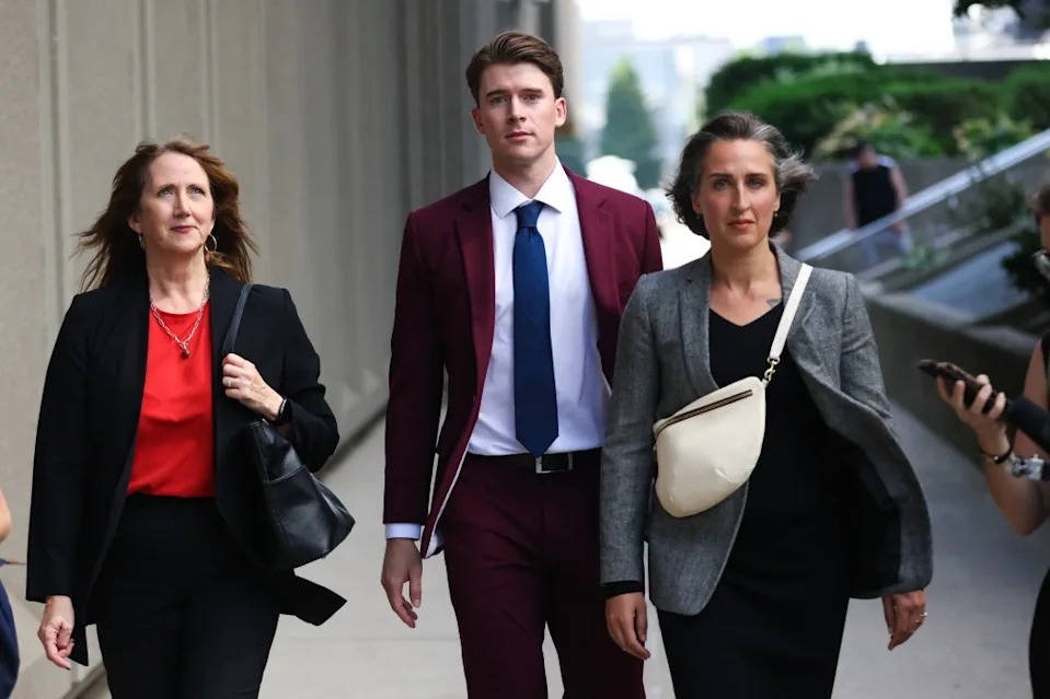 Carter Hart, centre, leaves the London Courthouse, in London, Ontario, Canada after being acquitted of sexual assault charges, on July 24, 2025. Getty Images