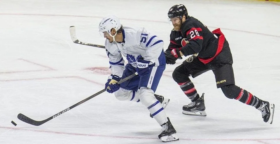  Ottawa Senators forward Claude Giroux looks to steal the puck away from Toronto Maple Leaf Philippe Myers on Sunday at the Canadian Tire Centre.